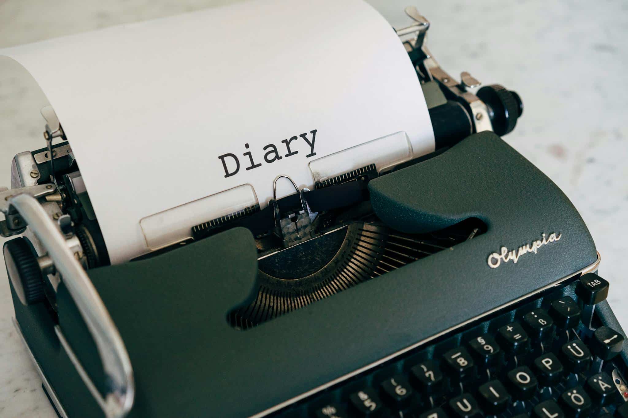 an old typewriter on white table